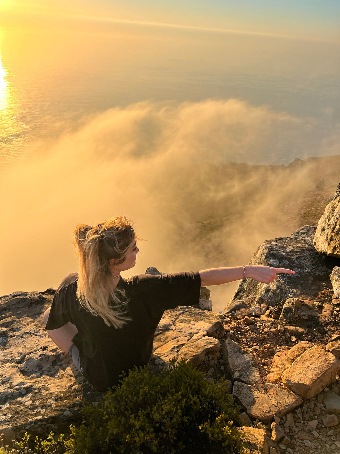 Group climbing Lion's Head chain section on a guided hike, Cape Town